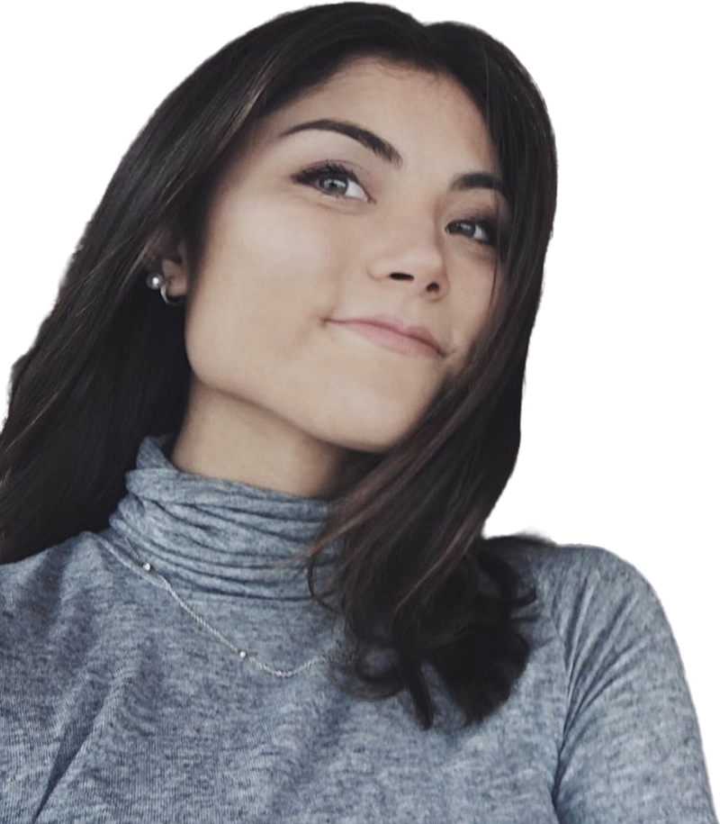 Een jonge vrouw met lang bruin haar draagt een grijze coltrui, kijkt nadenkend omhoog en glimlacht met herkenning.